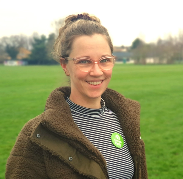 katie knight wearing green party badge